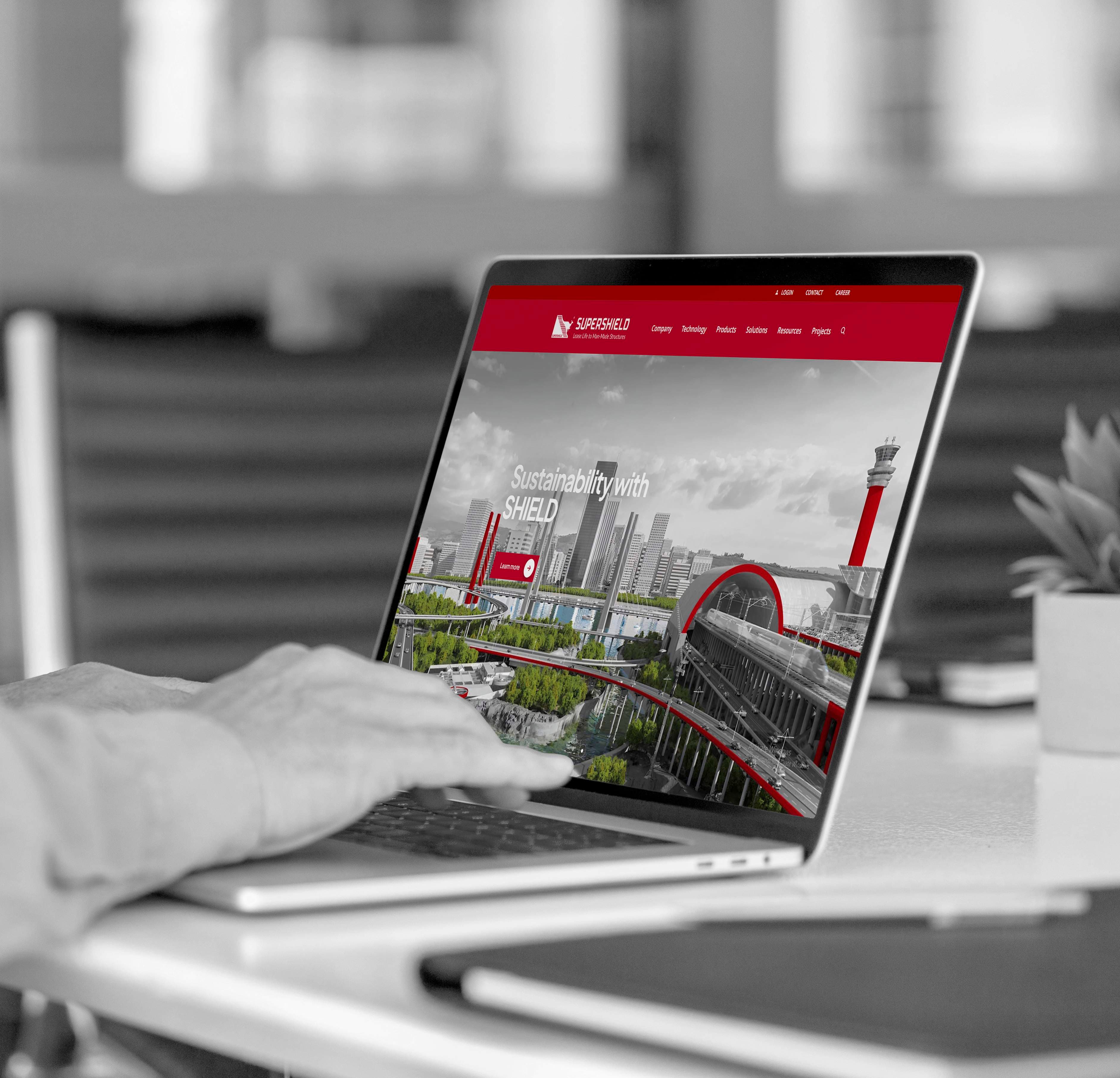Laptop showing SuperShield website